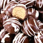 peanut butter chocolate truffles with white chocolate drizzle
