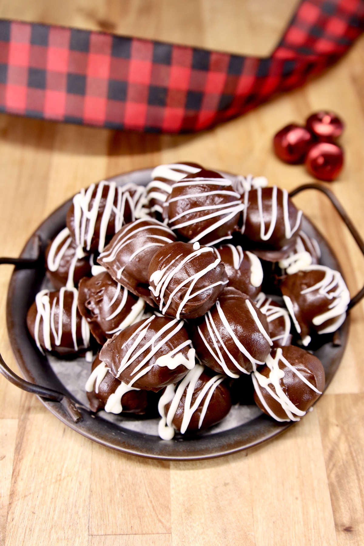 peanut butter truffles on a platter with holiday ribbon