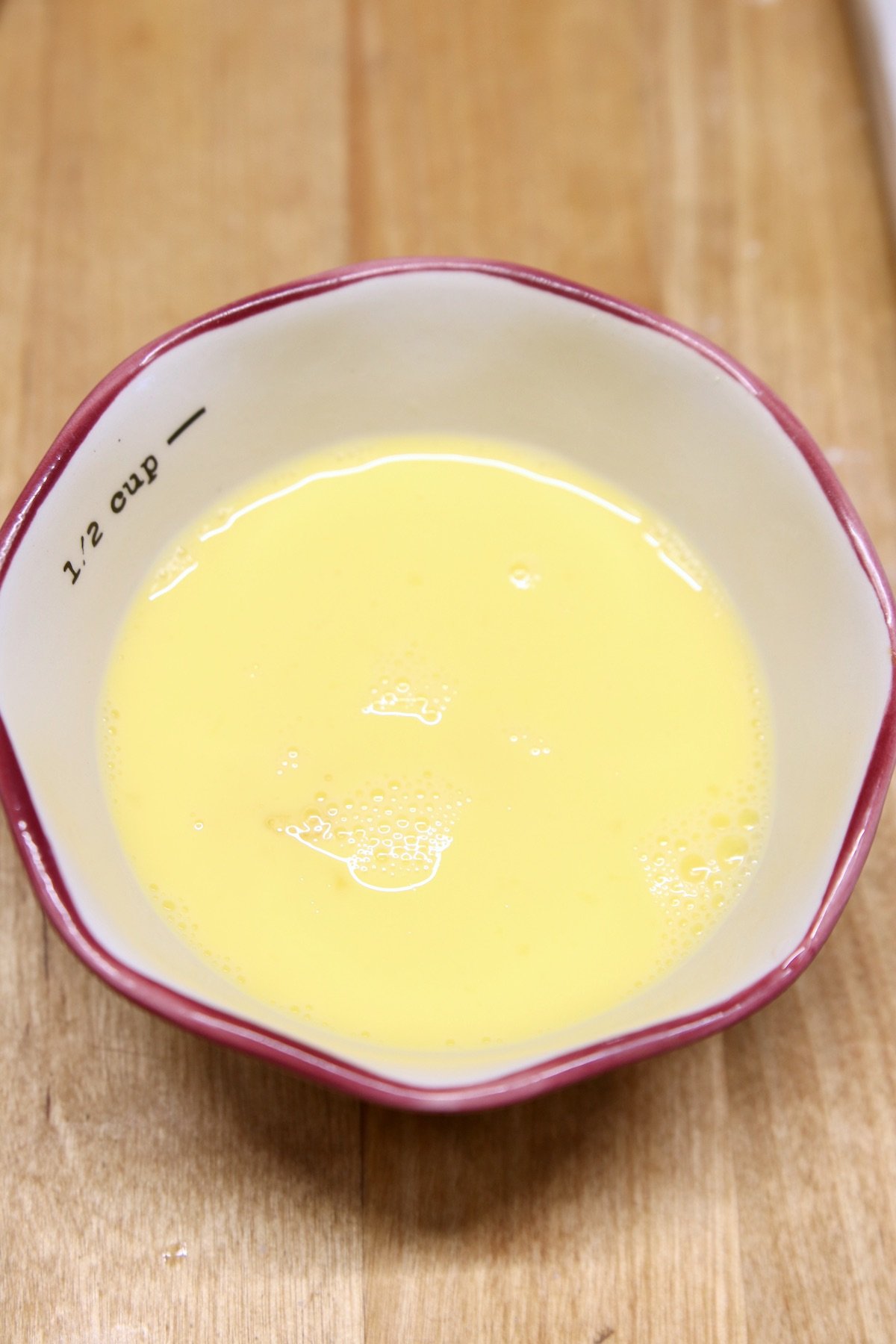 bowl of egg and water mixed for egg wash