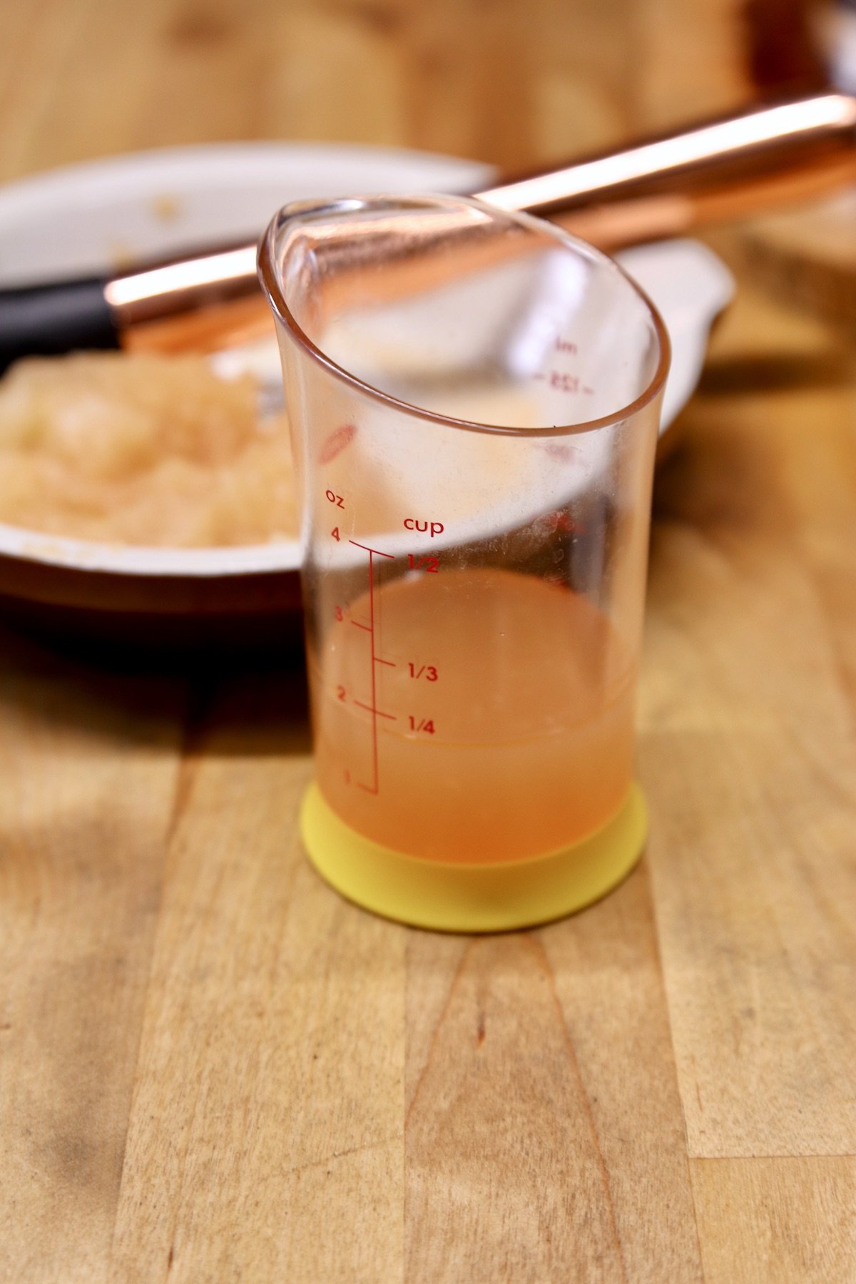 pear juice in a measuring beaker