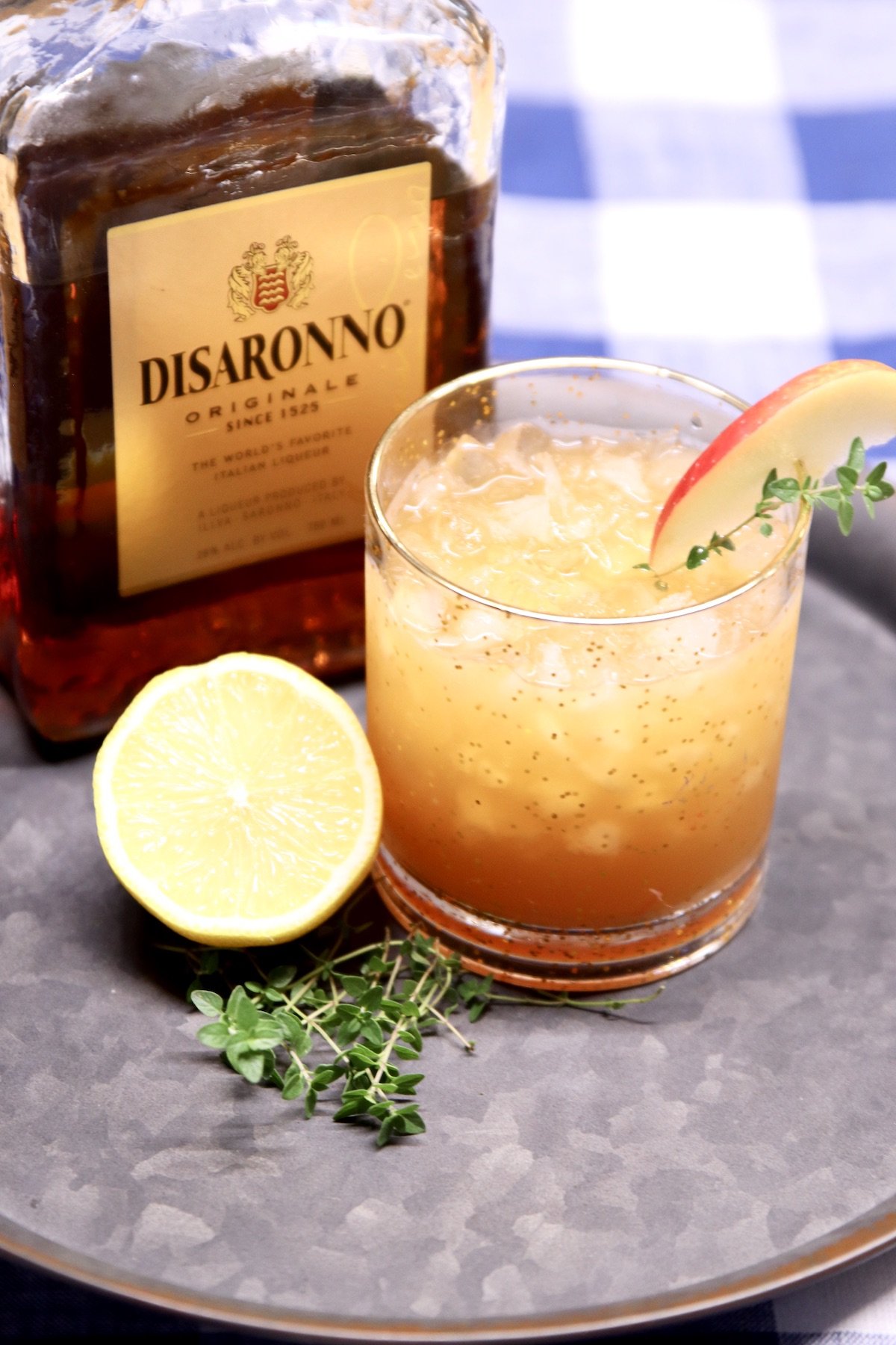bottle of Disaronno with apple cider cocktail