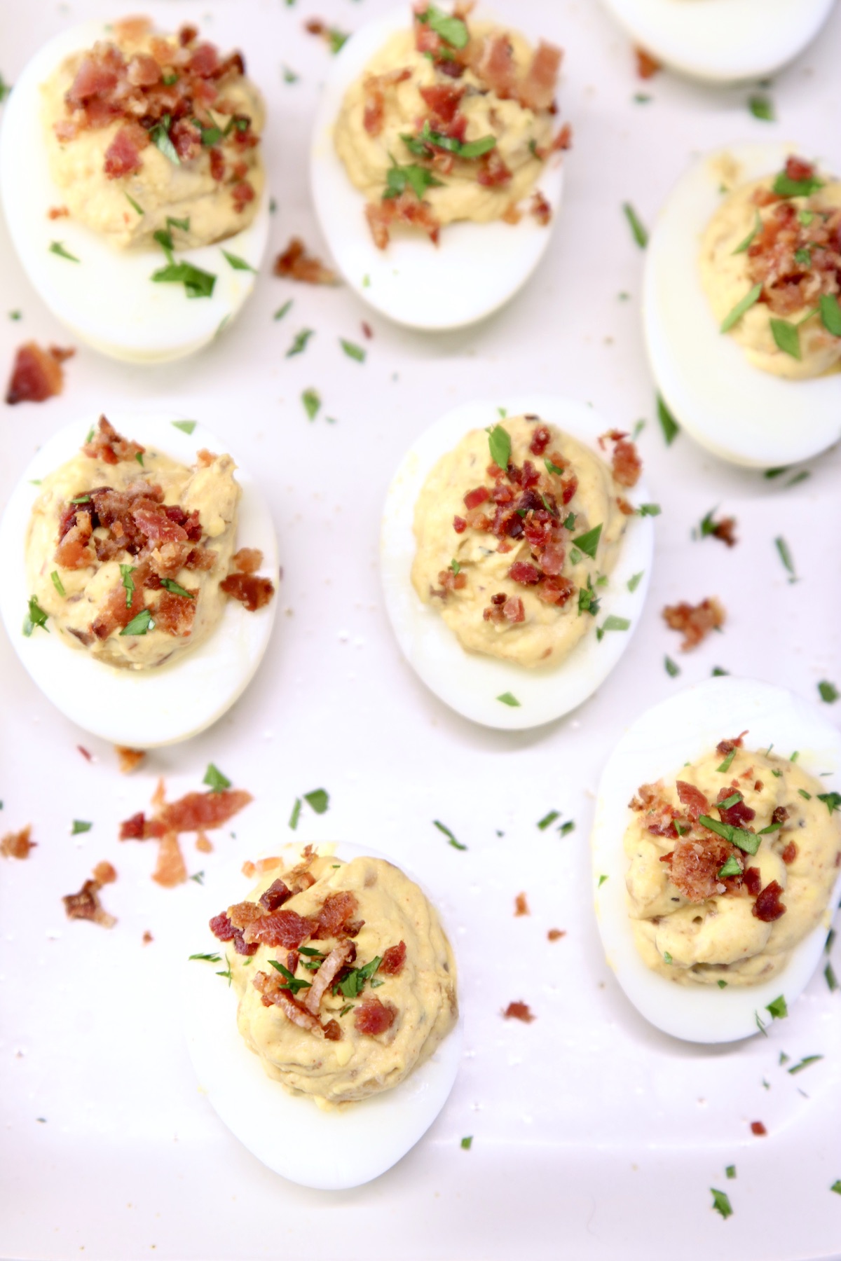 platter of deviled eggs with bacon