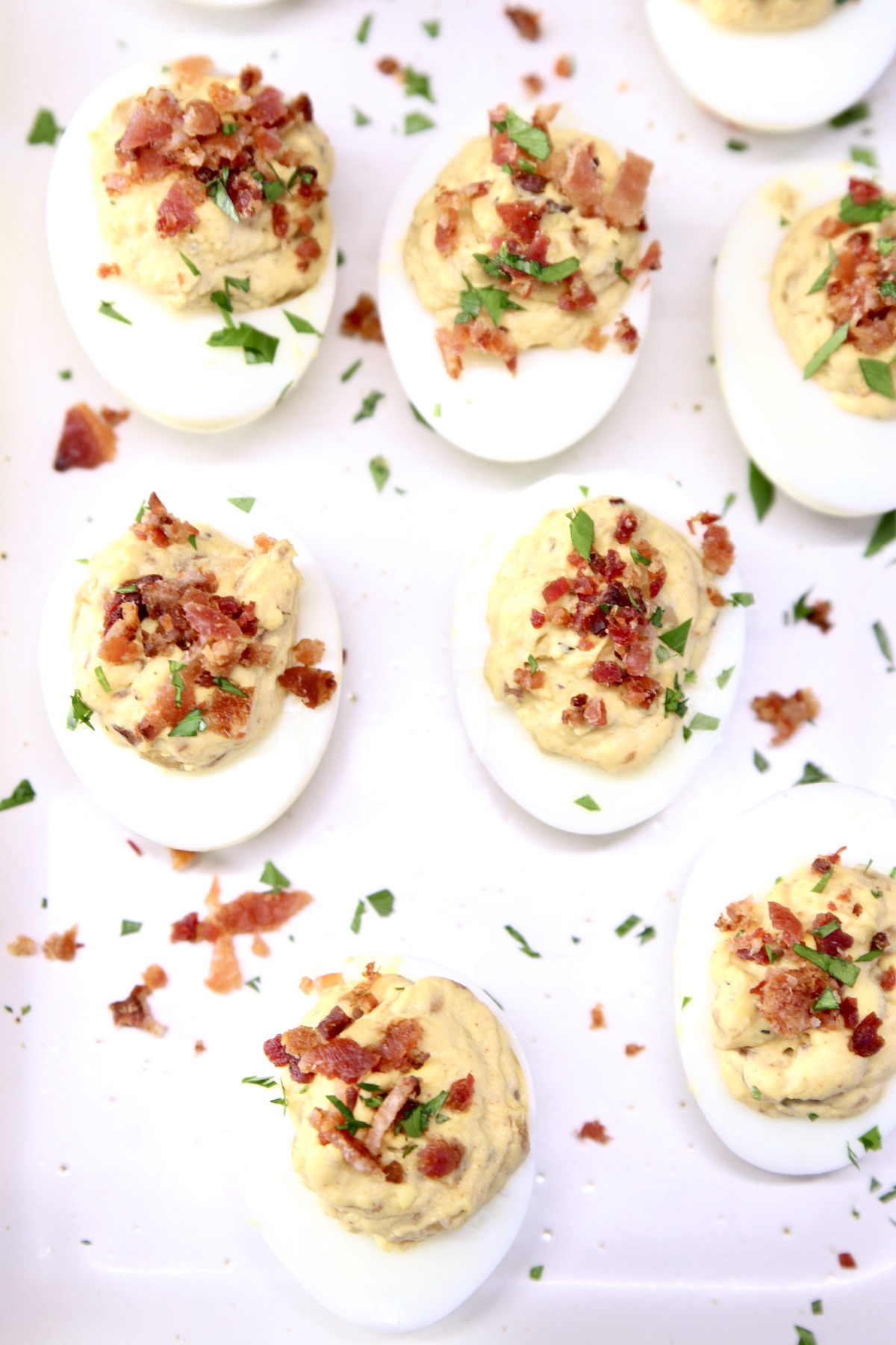 overhead of tray of deviled eggs with bacon crumbles