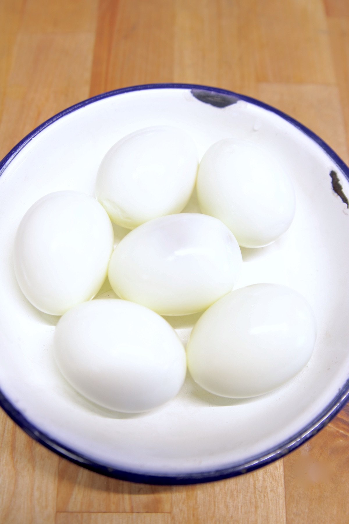 boiled eggs in a bowl -peeled