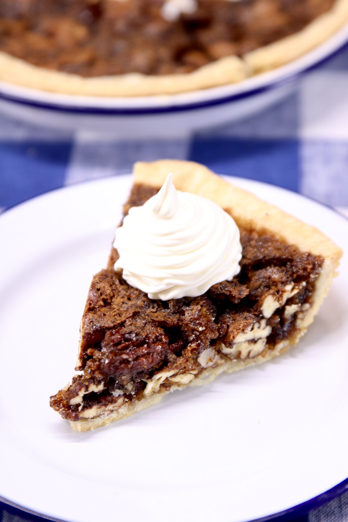 slice of pecan pie with whipped topping