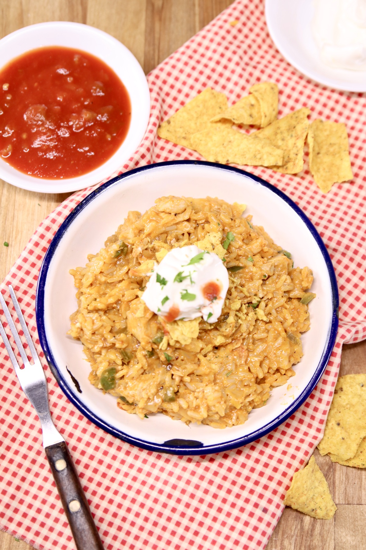 cheesy chicken taco rice with sour cream and salsa