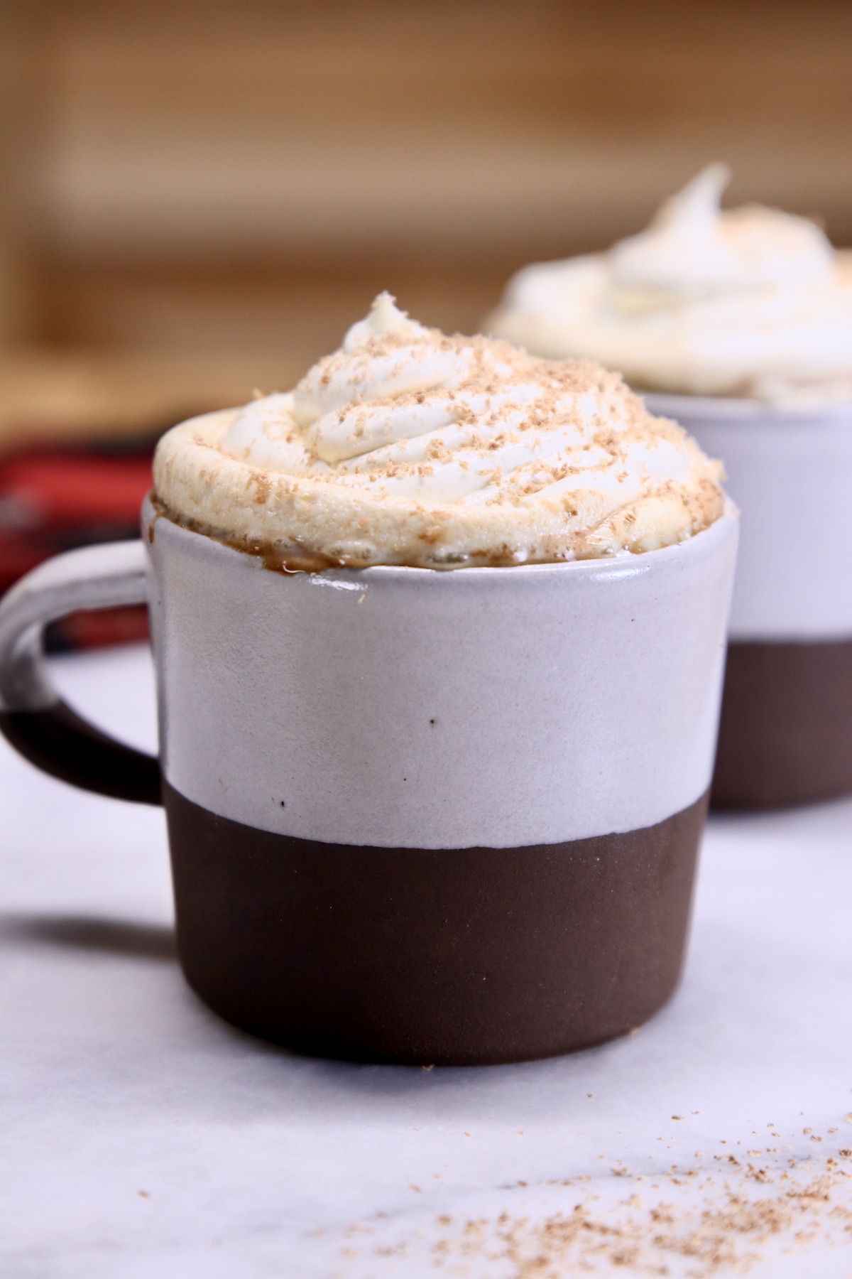 mugs of hot chocolate with whipped cream