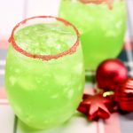 lime punch in a glass with red sugar rim