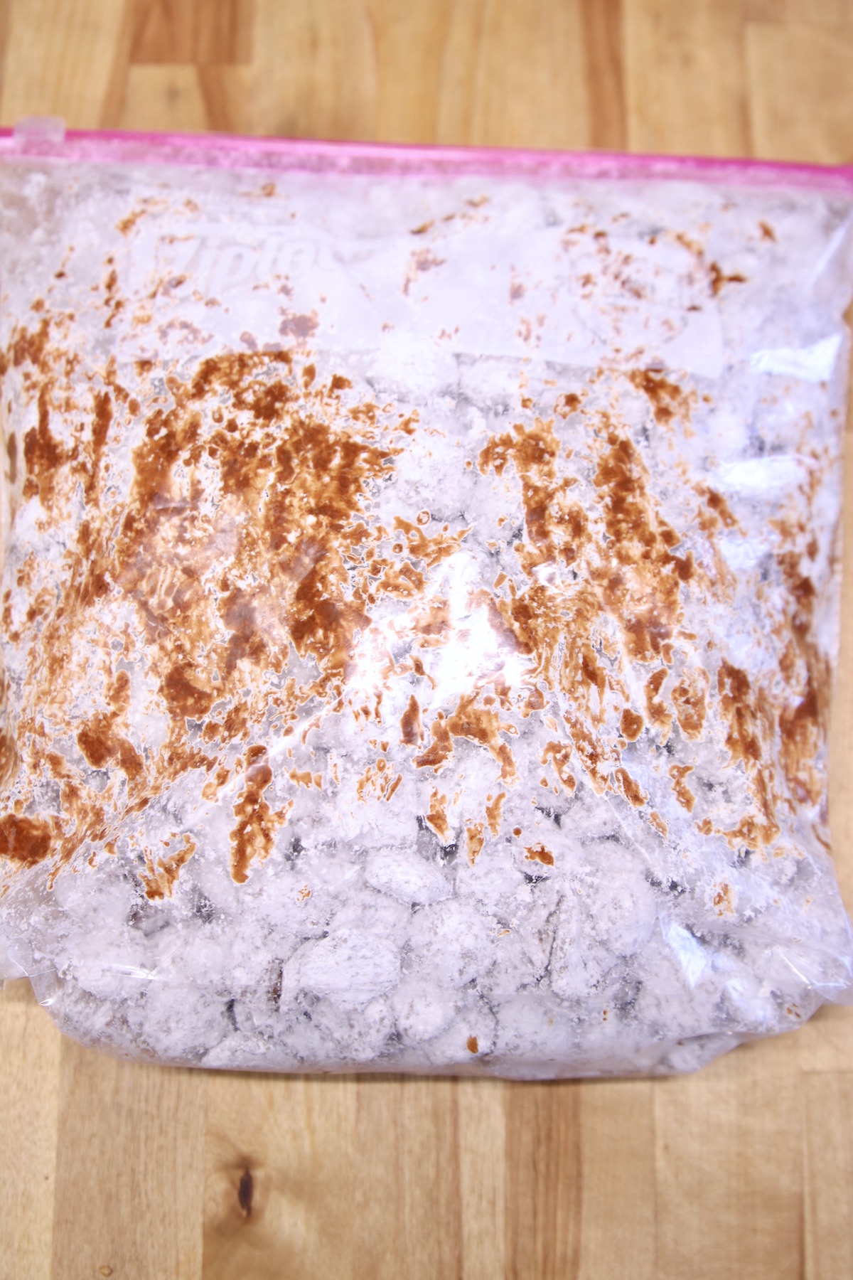 baggie of powdered sugar coated muddy buddies