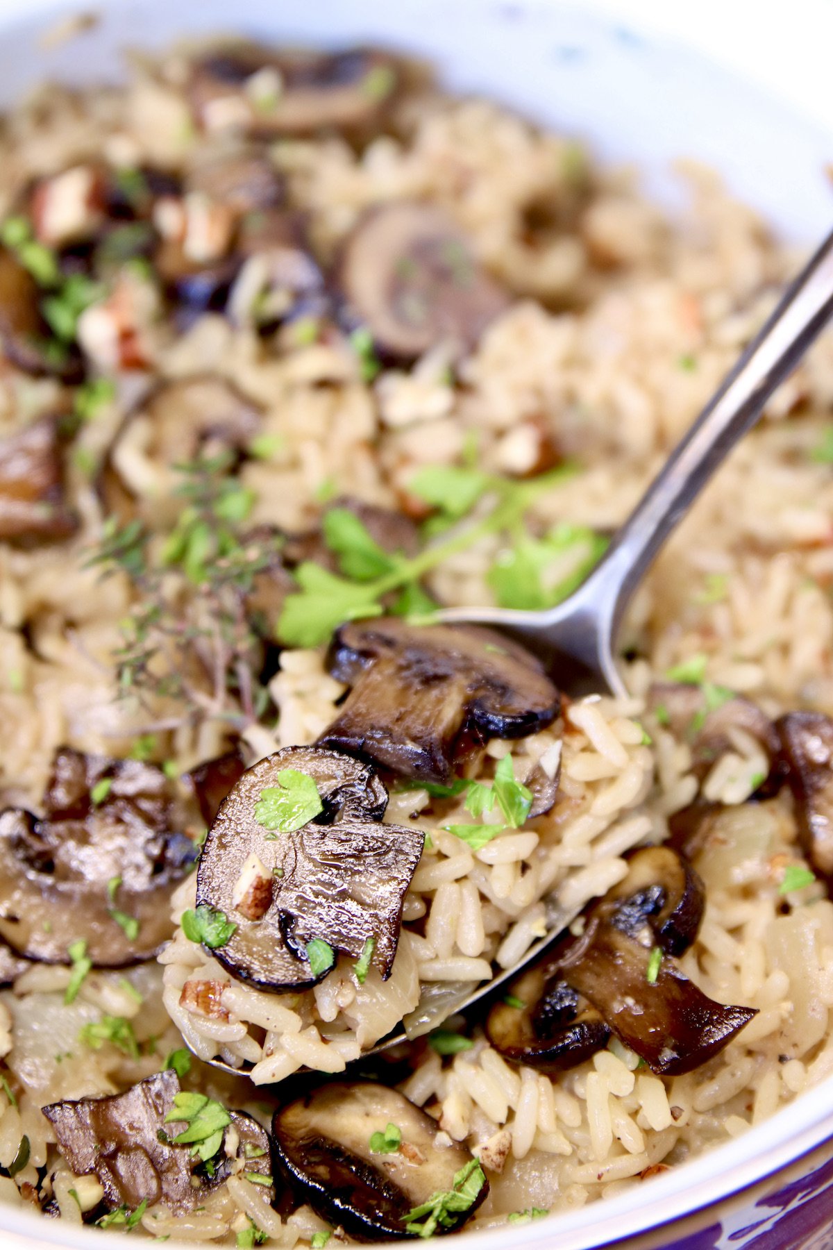 mushroom rice - spoonful in a pan