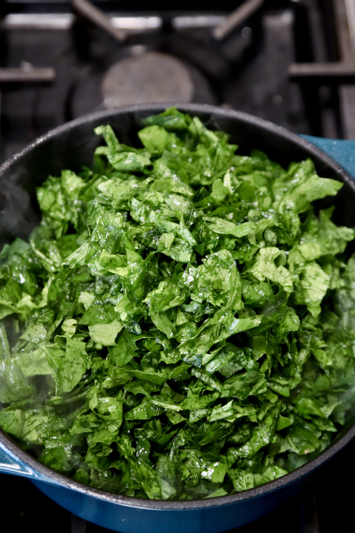 chopped turnip greens in a pan