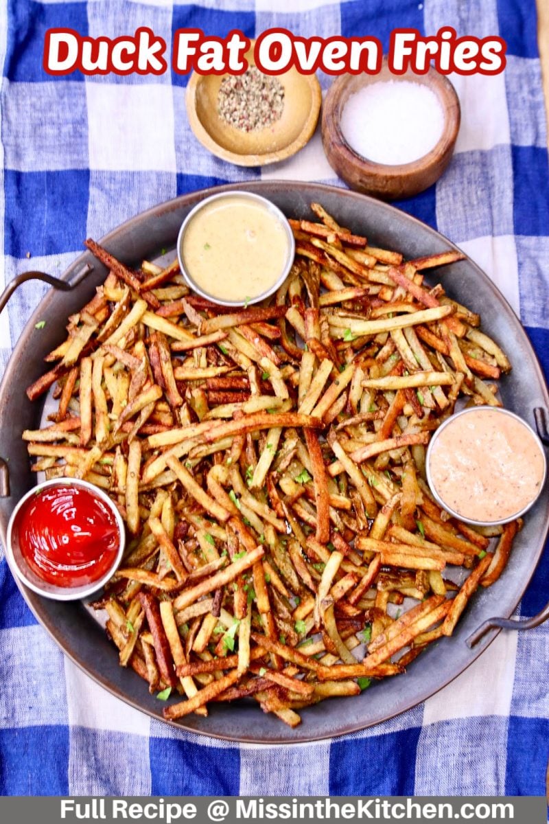 duck fat fries on a tray with 3 dipping sauces - text over