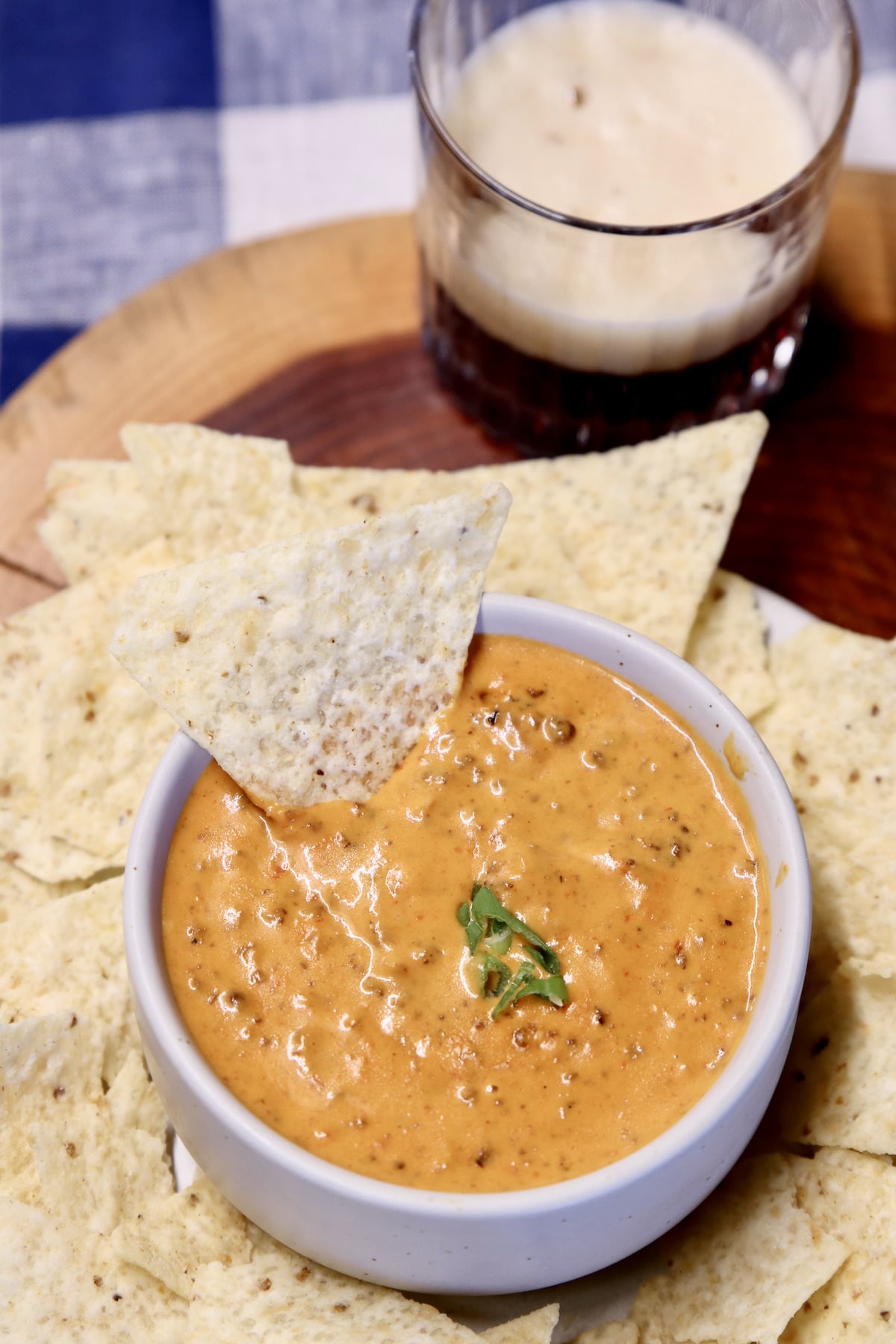 chili cheese dip in a bowl with tortilla chips.