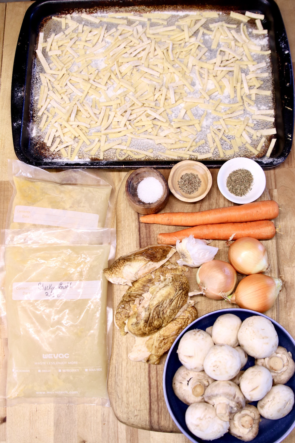 ingredients for chicken noodle soup with mushrooms.