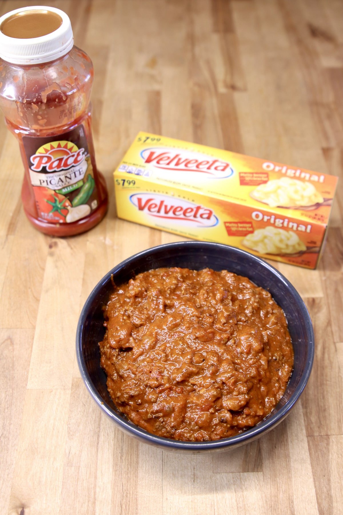 picante sauce, Velveeta, Chili in a bowl for dip.