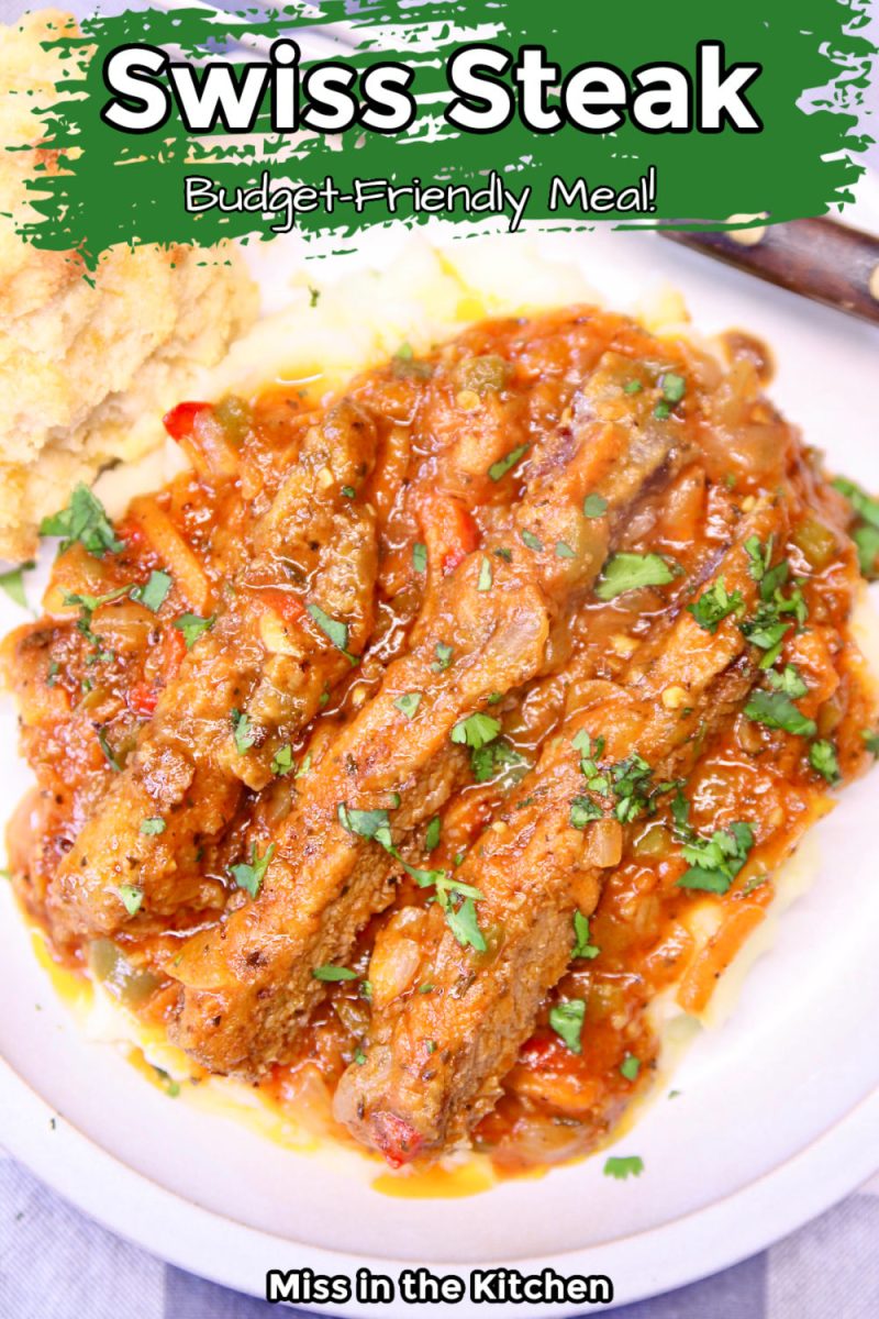 Swiss Steak on a plate with mashed potatoes- closeup with text overlay.