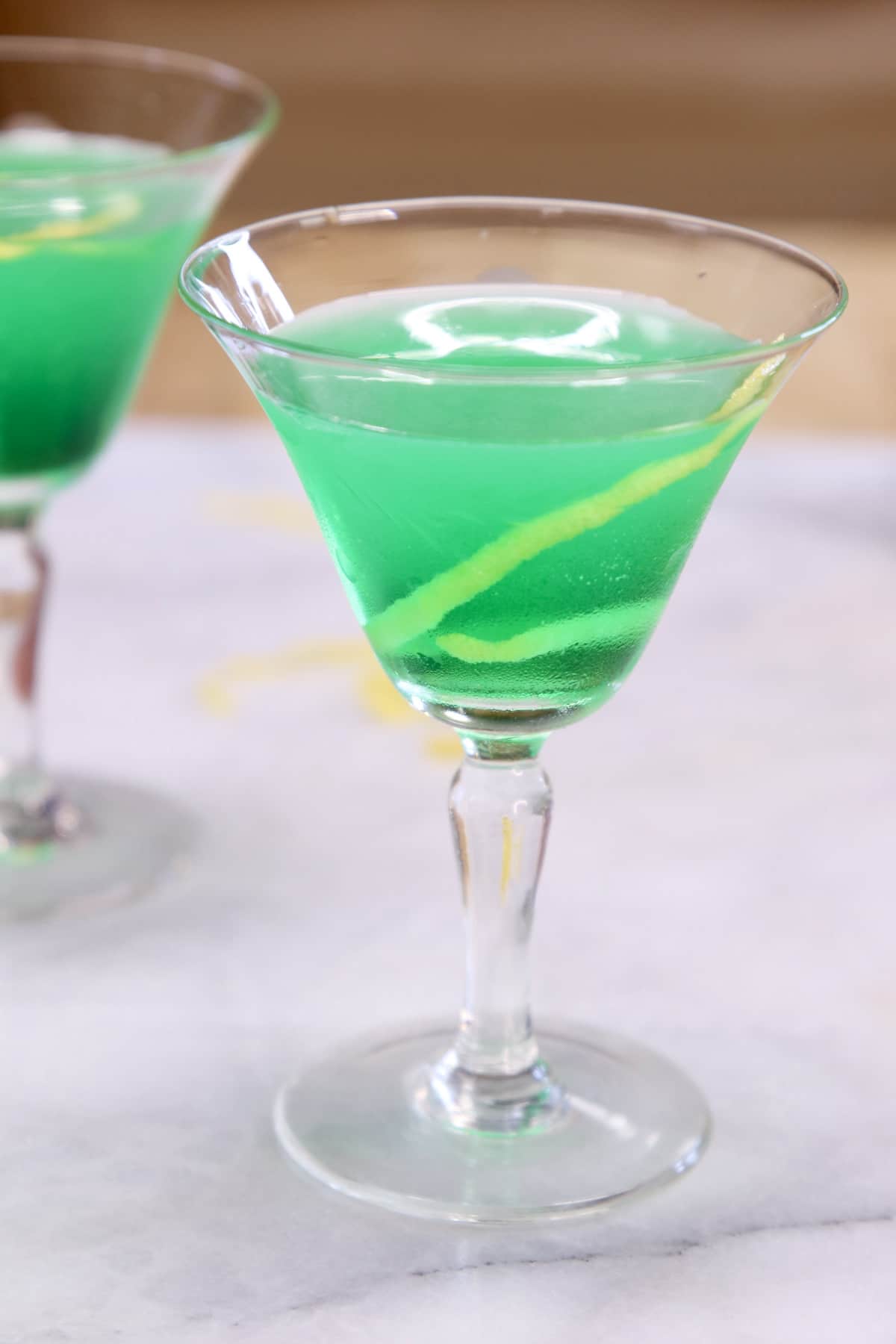 Irish Martini cocktail with lemon garnish.