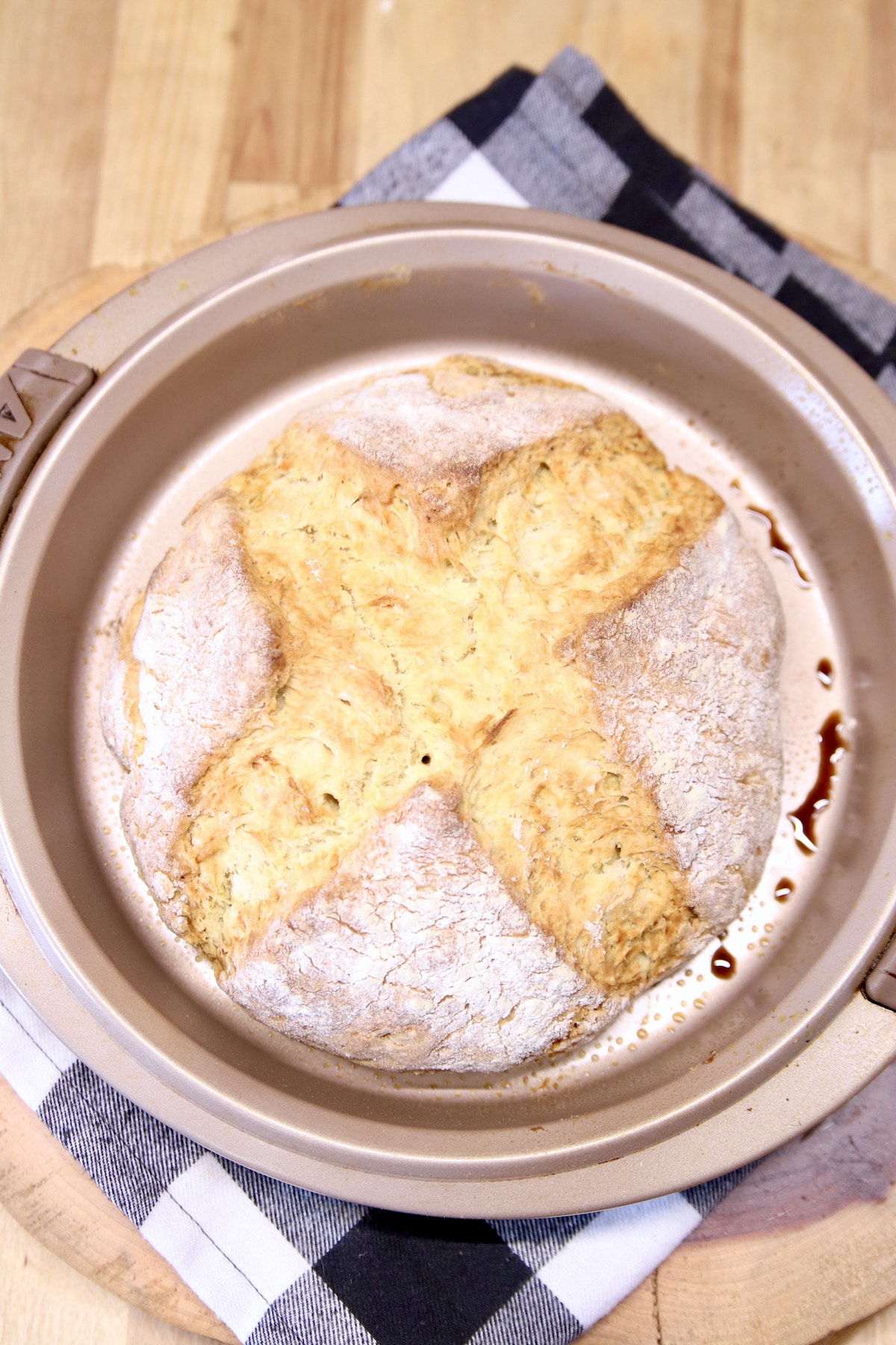 Baked soda bread in a round pan.
