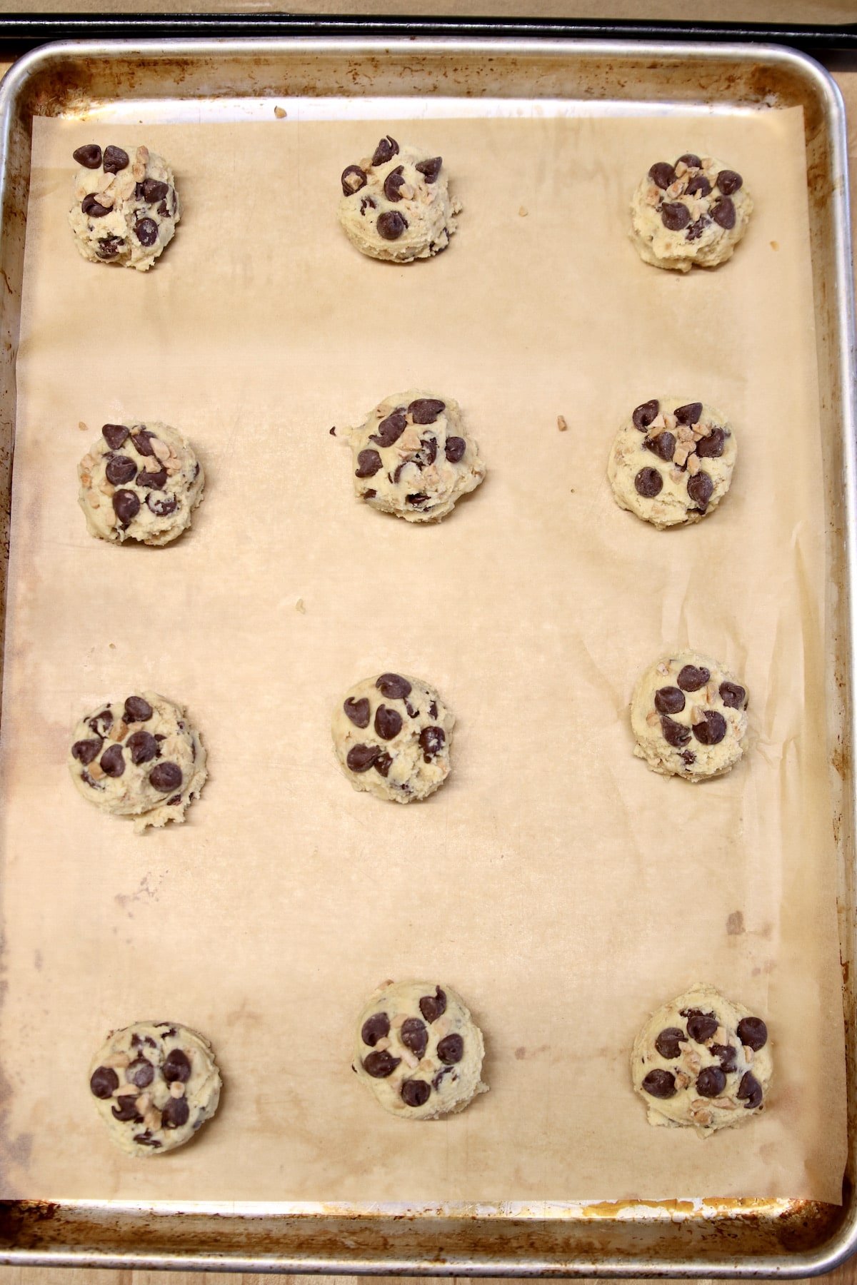 Baking sheet with chocolate chip cookie dough.