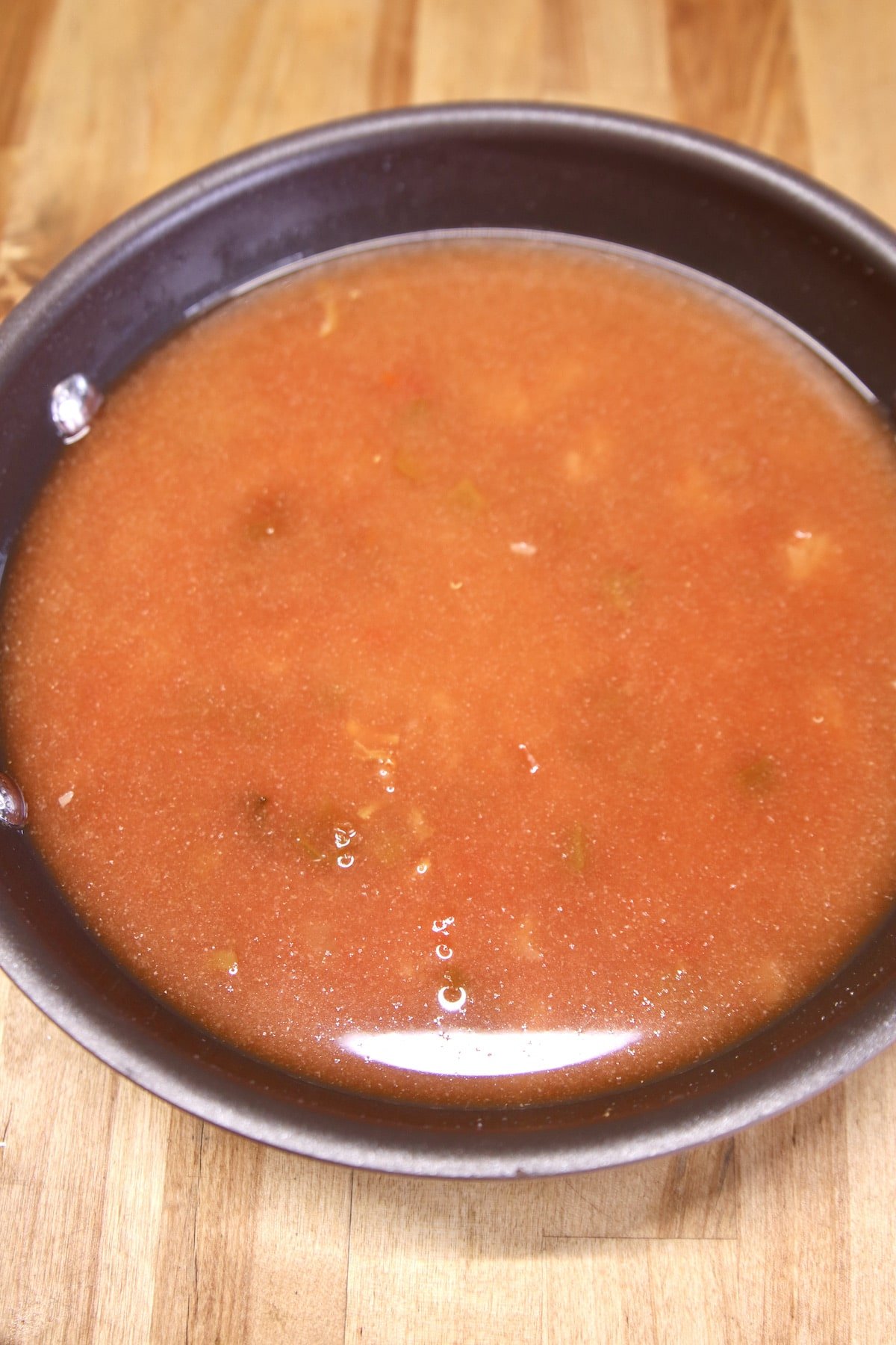 pan of Spanish rice with salsa.