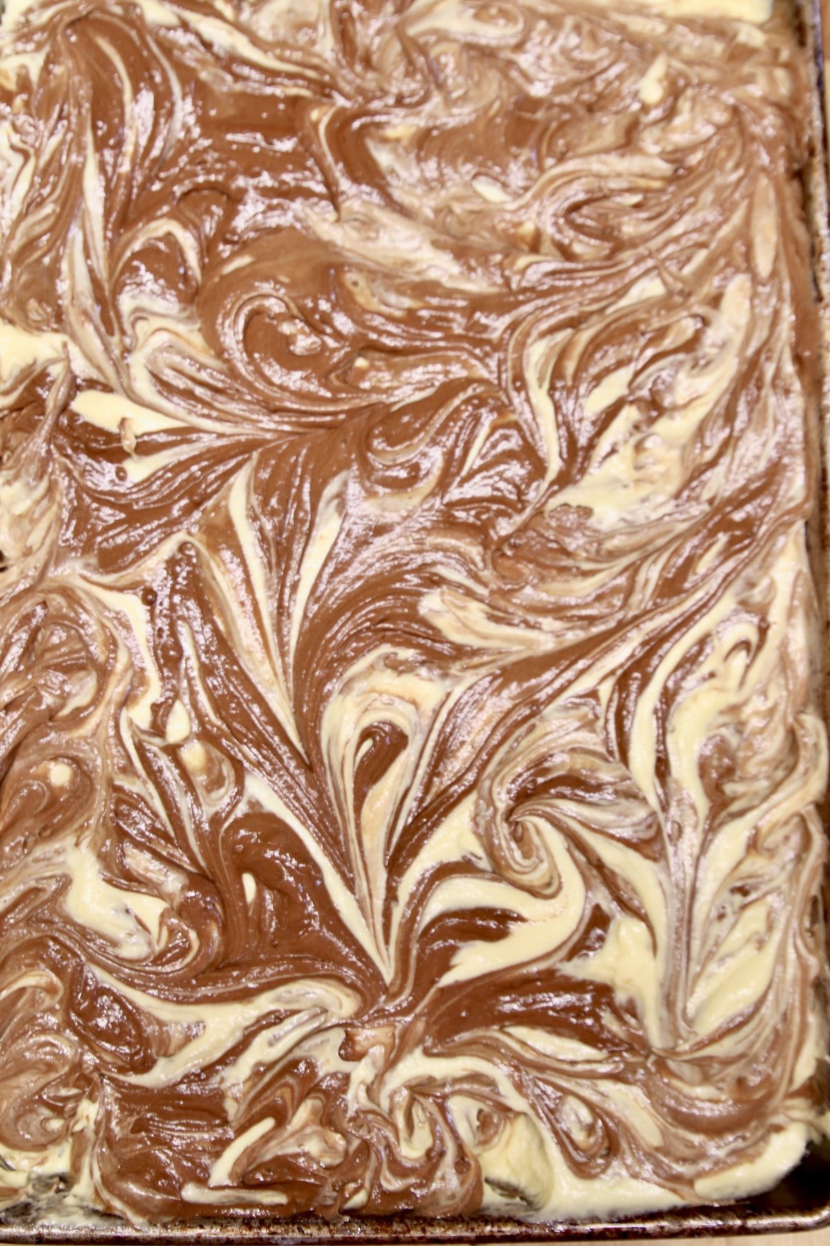 marbled cake batter in pan.