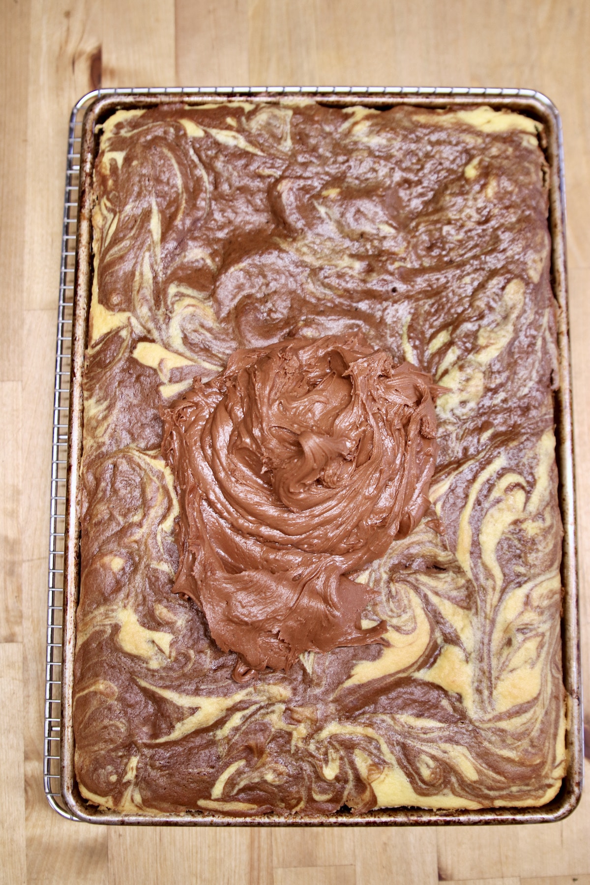 chocolate frosting on marble cake.