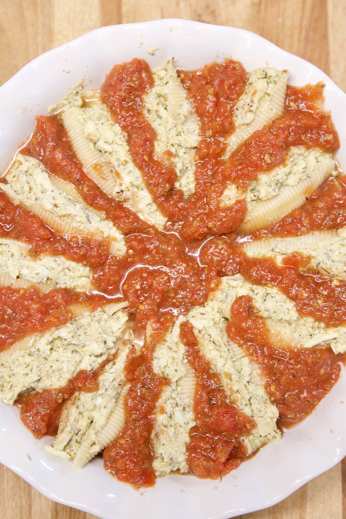 Stuffed jumbo pasta shells in tomato sauce.