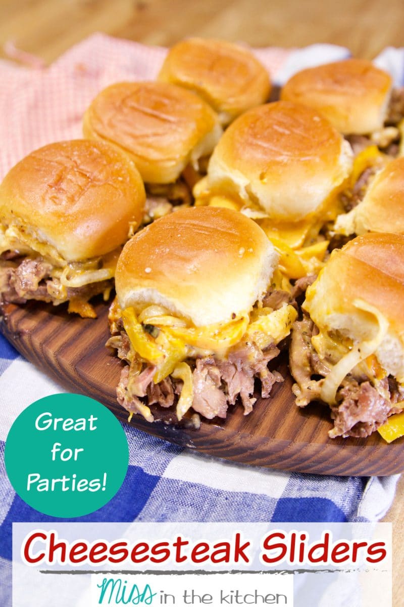 Cheesesteak Sliders on a serving board with text overlay.