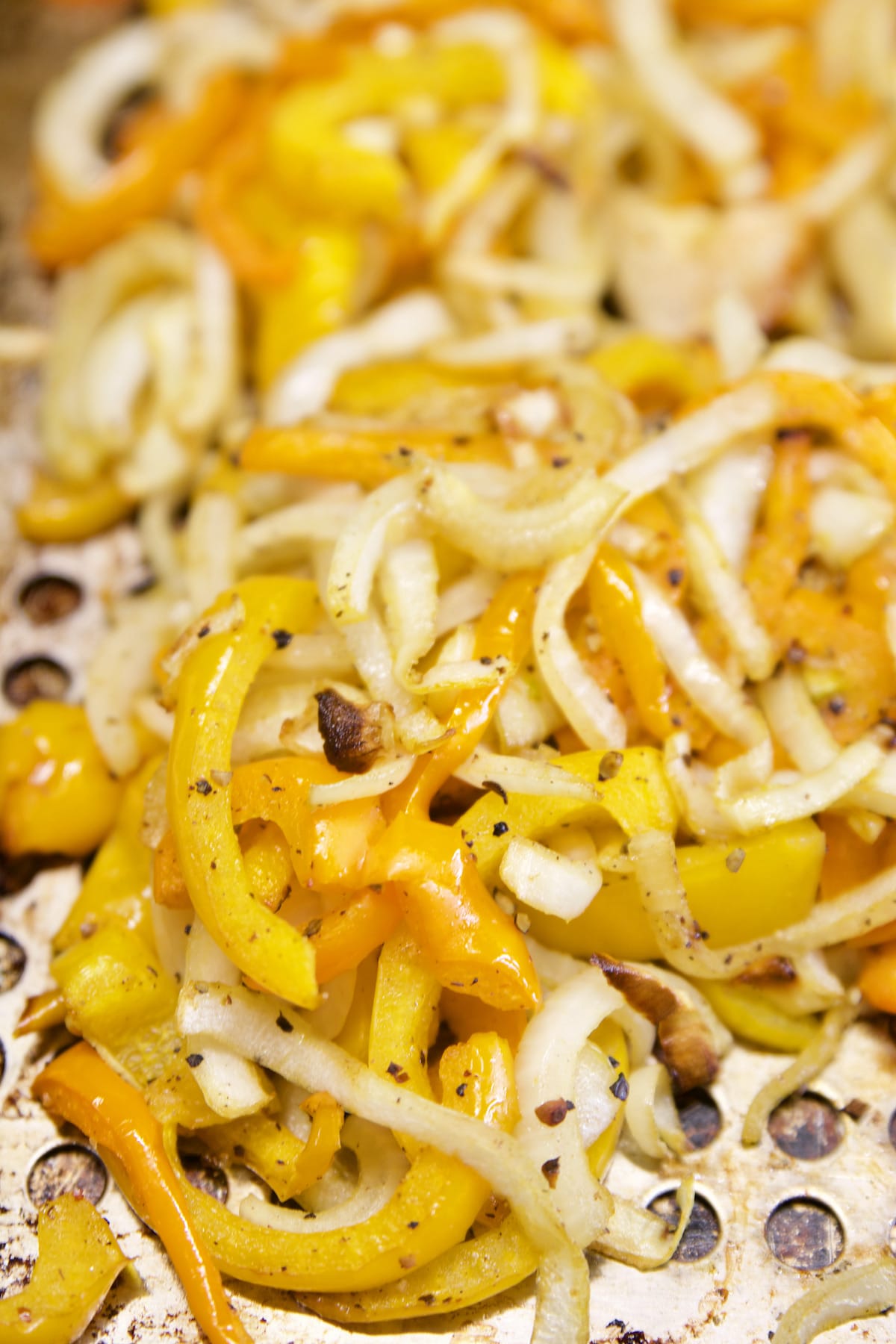 Grilled onions, peppers for sliders.