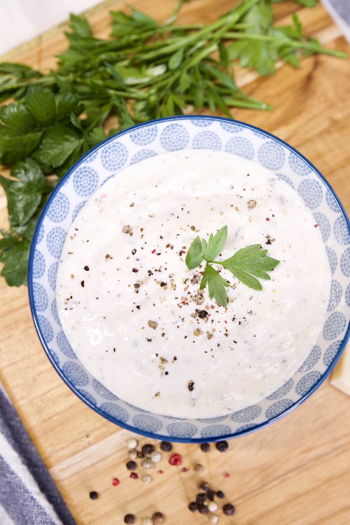 Bowl of ranch dip with parsley.