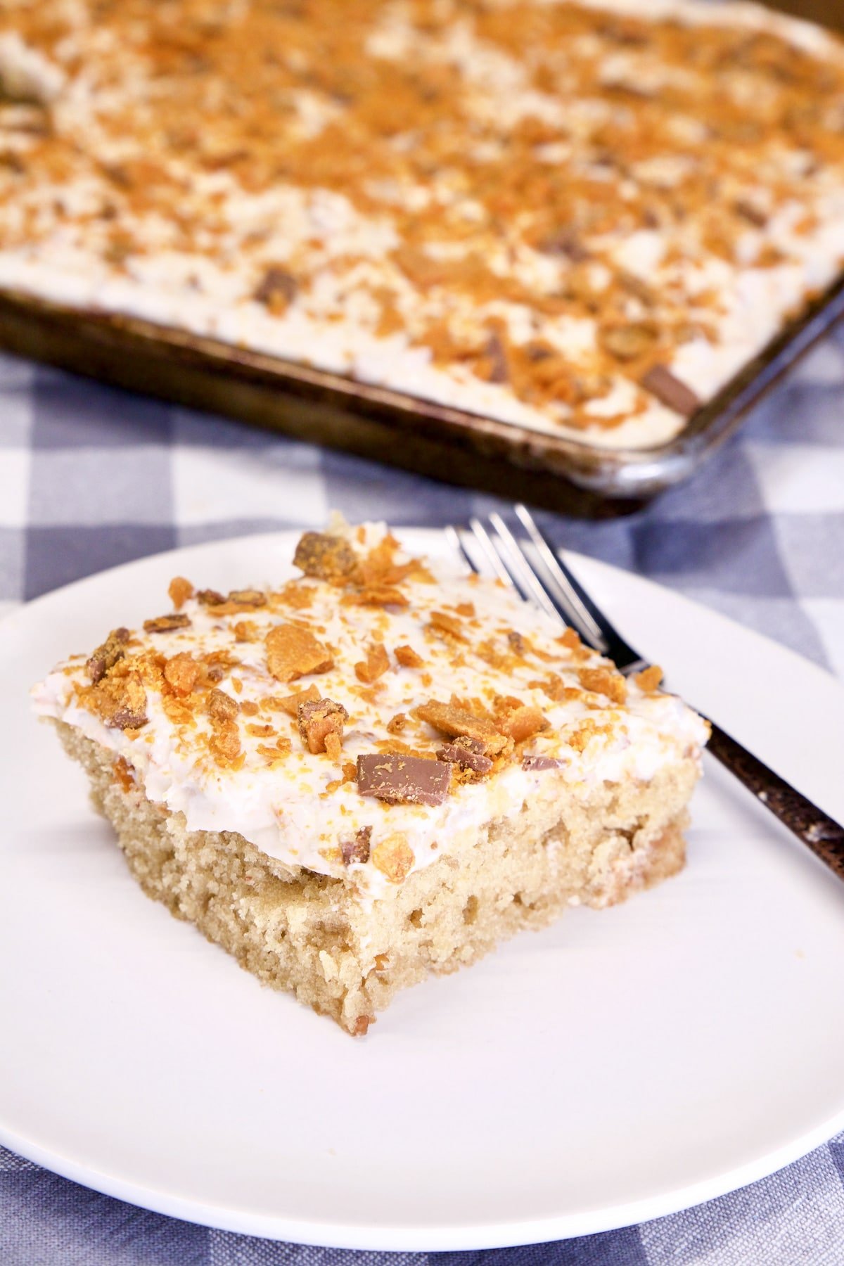 Peanut Butter Sheet Cake with Butterfinger Icing - slice on a plate.