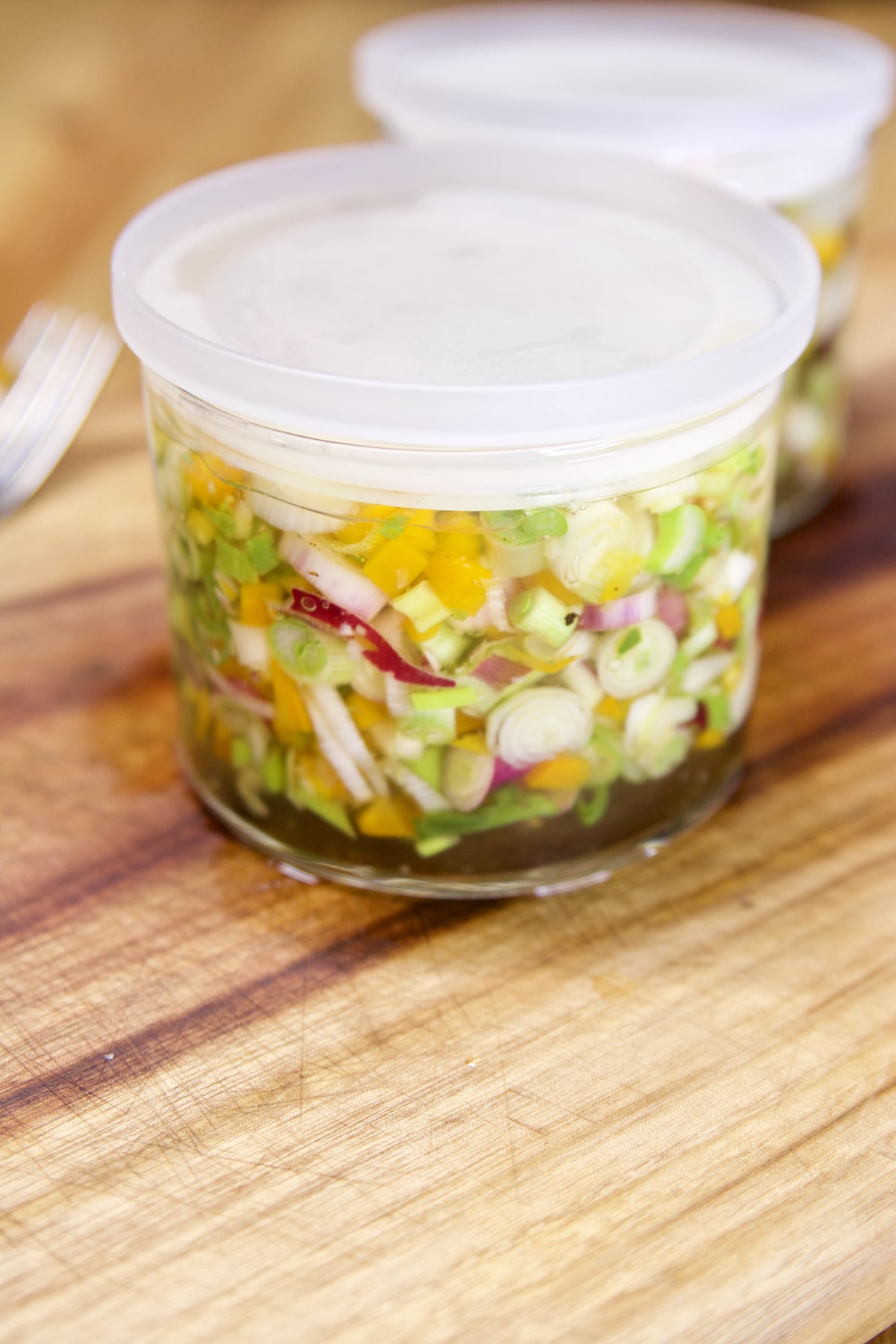 Picked Green Onion Relish in jars with lids.