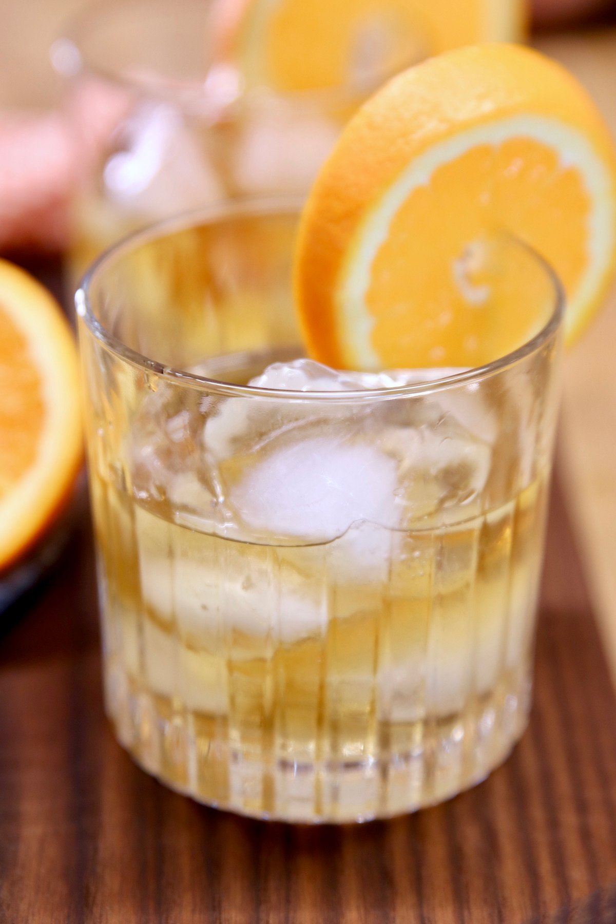 Smoked Old Fashioned Cocktail with orange garnish.