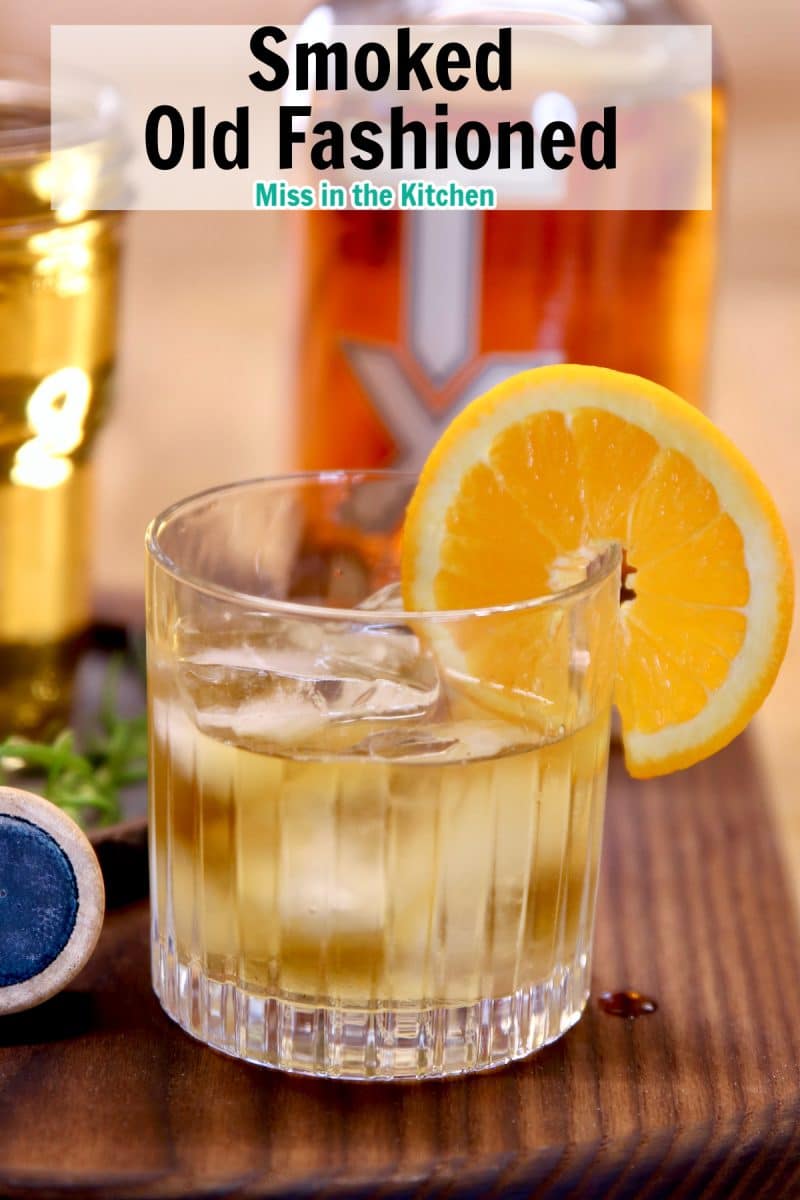 Old Fashioned Cocktail with orange garnish.