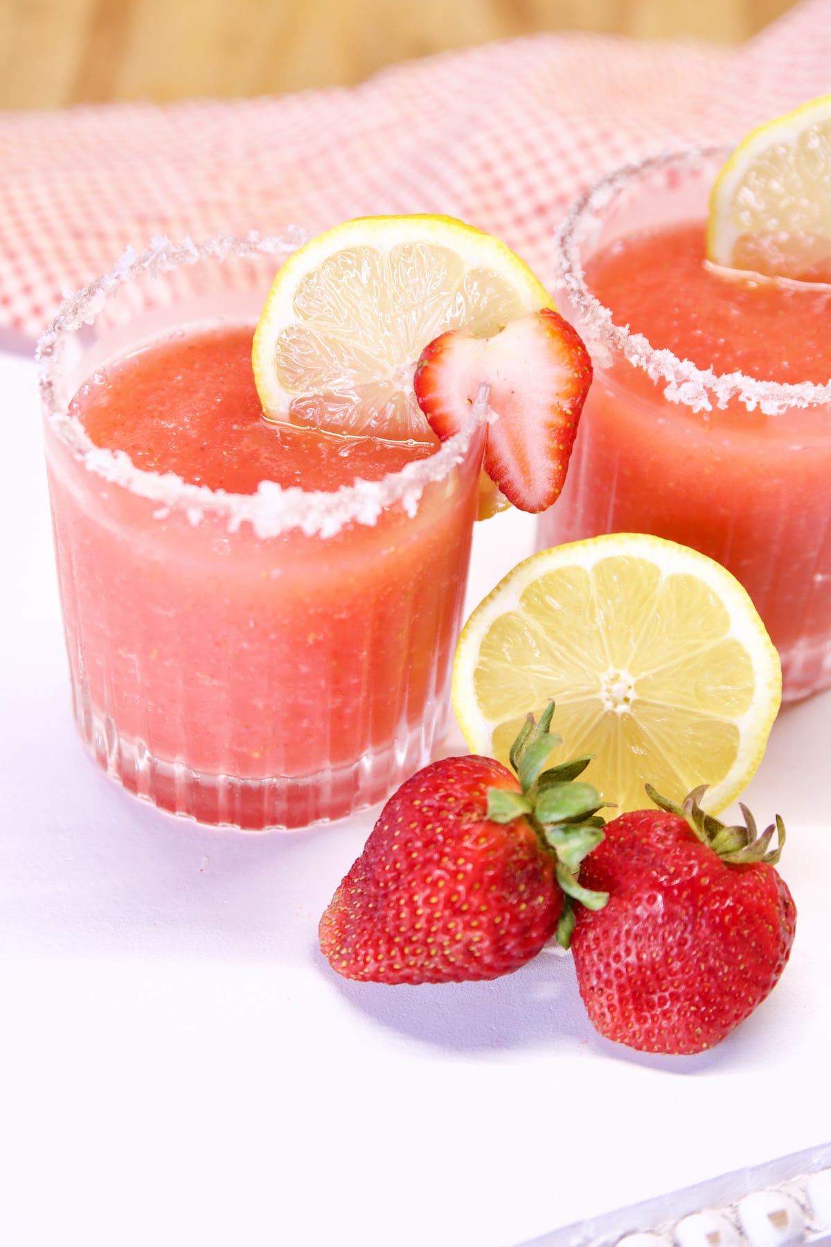 2 glasses of strawberry margaritas.
