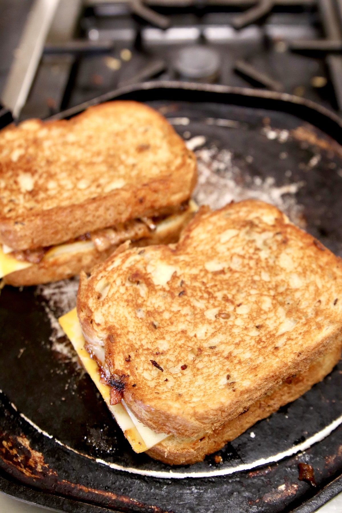 Toasting brisket grilled cheese sandwiches.
