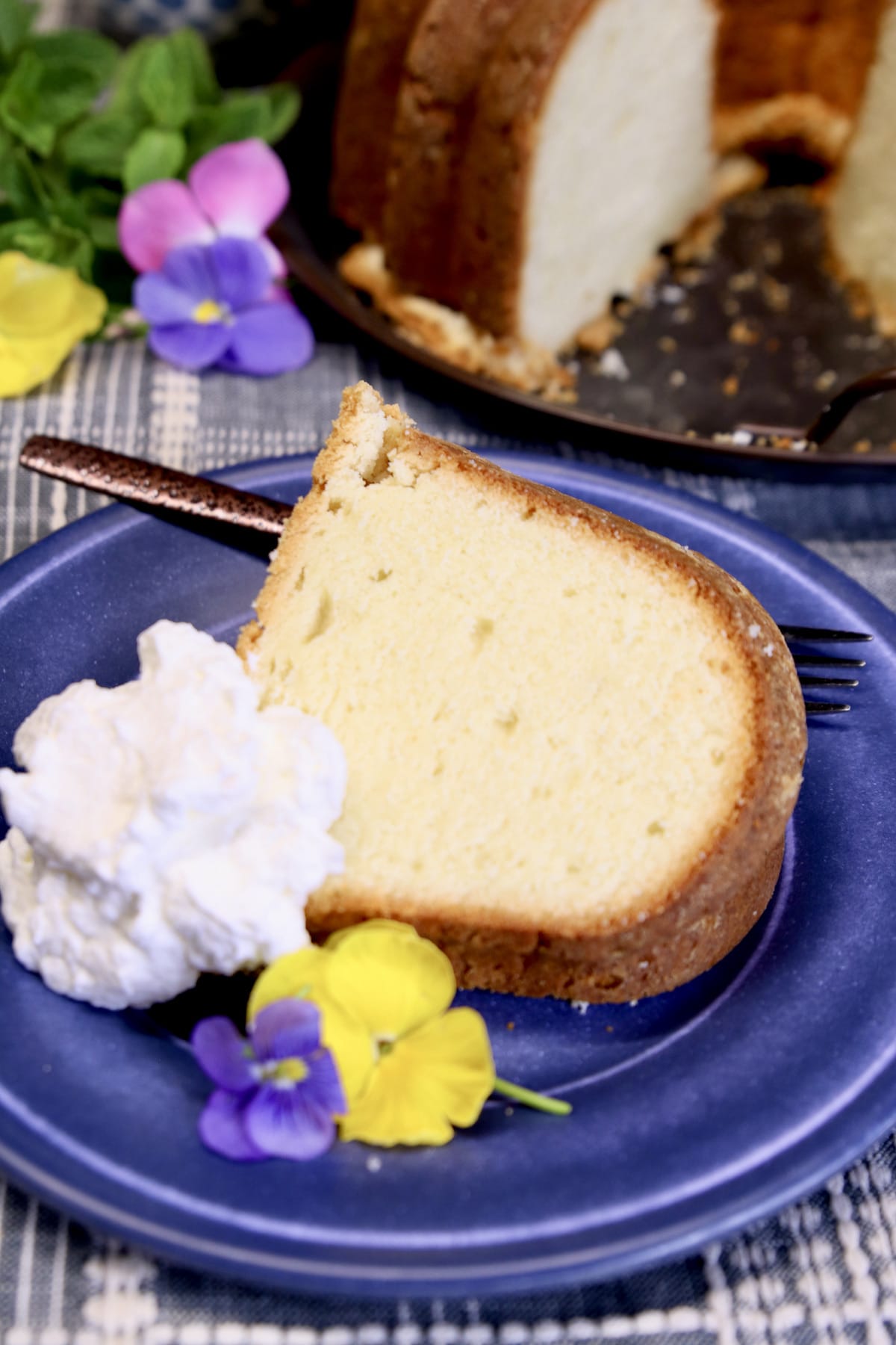 Slice of pound cake with whipped cream.
