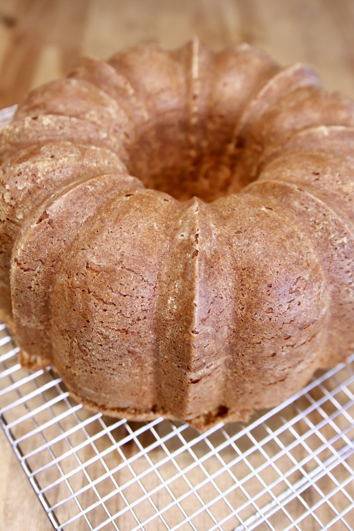 Pound cake cooling on a wire rack.