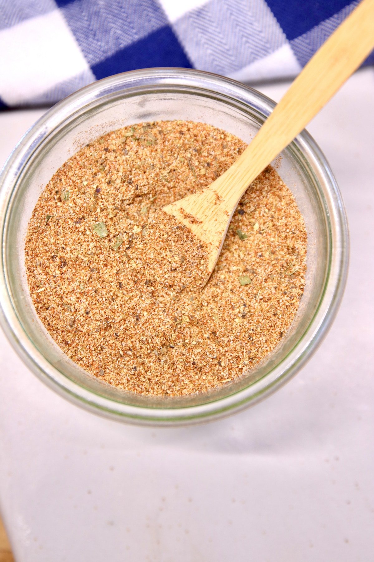 Cajun spice blend in a bowl with spoon.