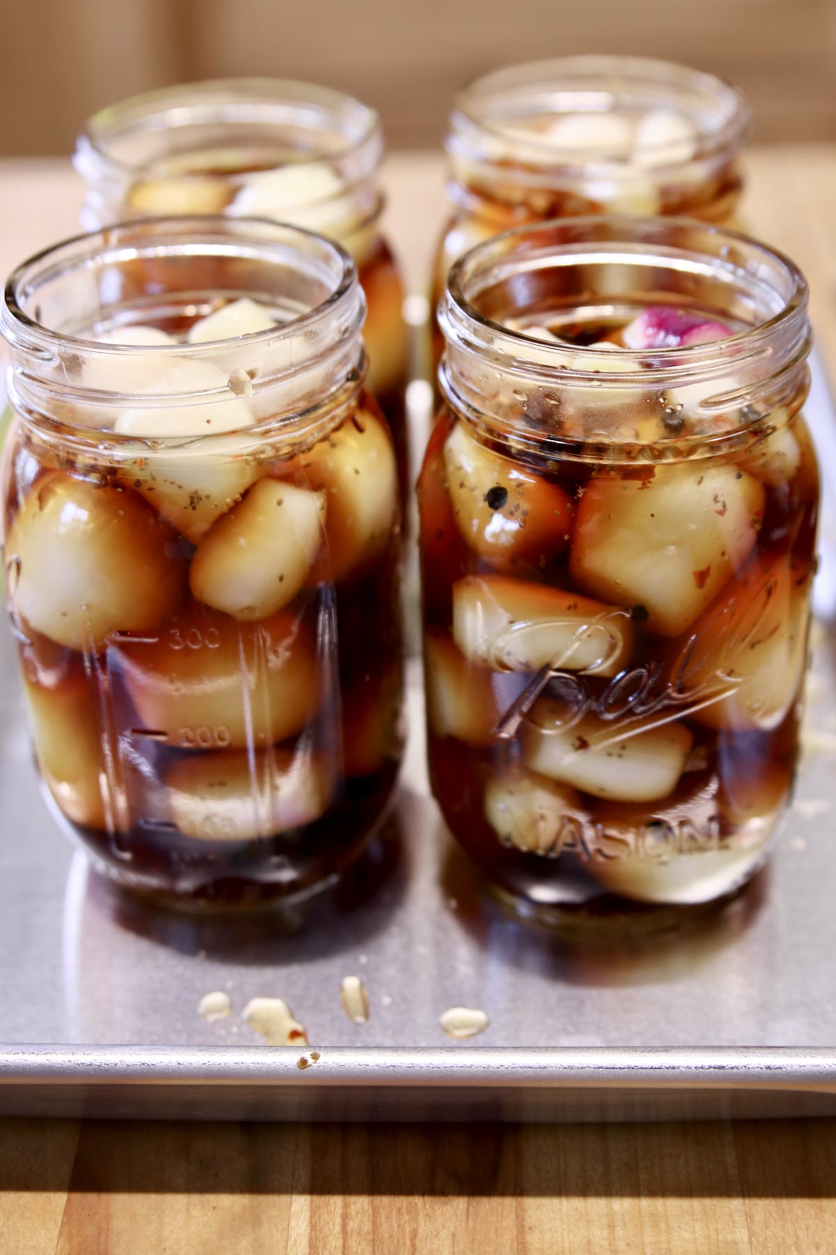 Pickled Onions in 4 jars.