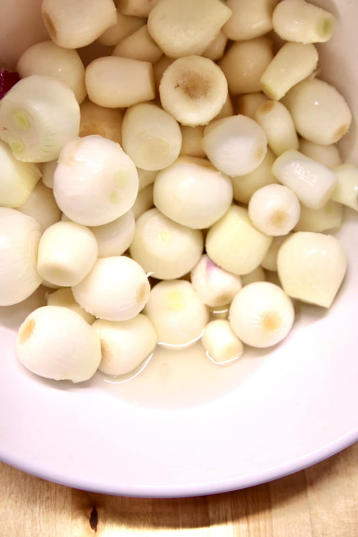 Onions in a bowl, with moisture removed. 