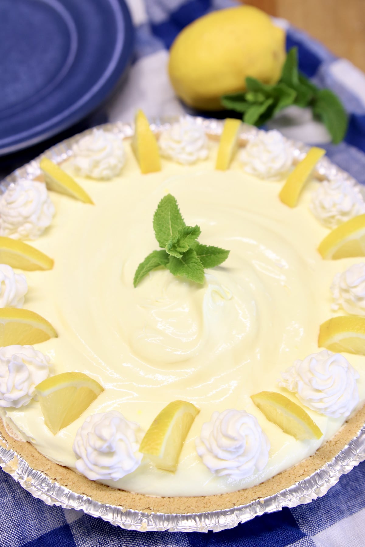 closeup of lemon pie with lemon garnish.