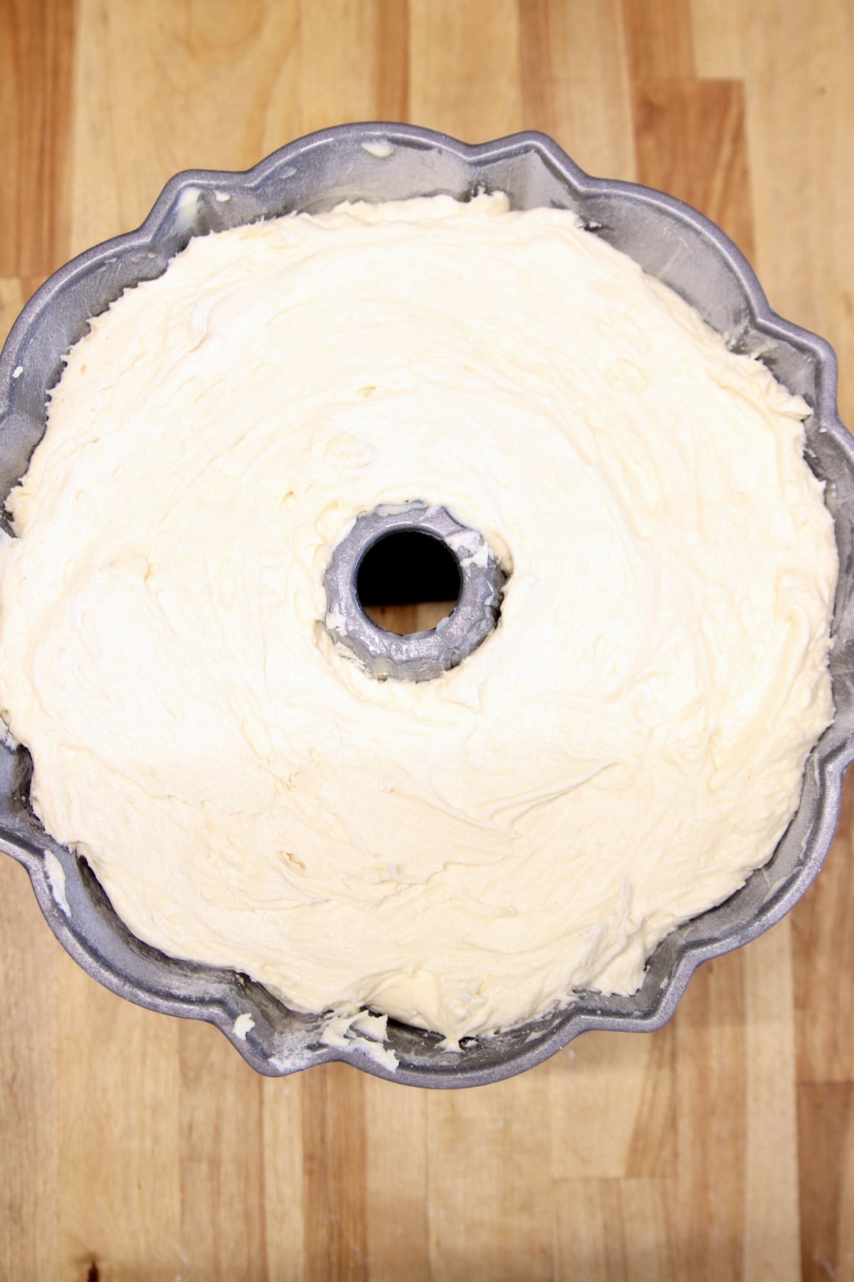 Pound cake batter in a bundt pan.