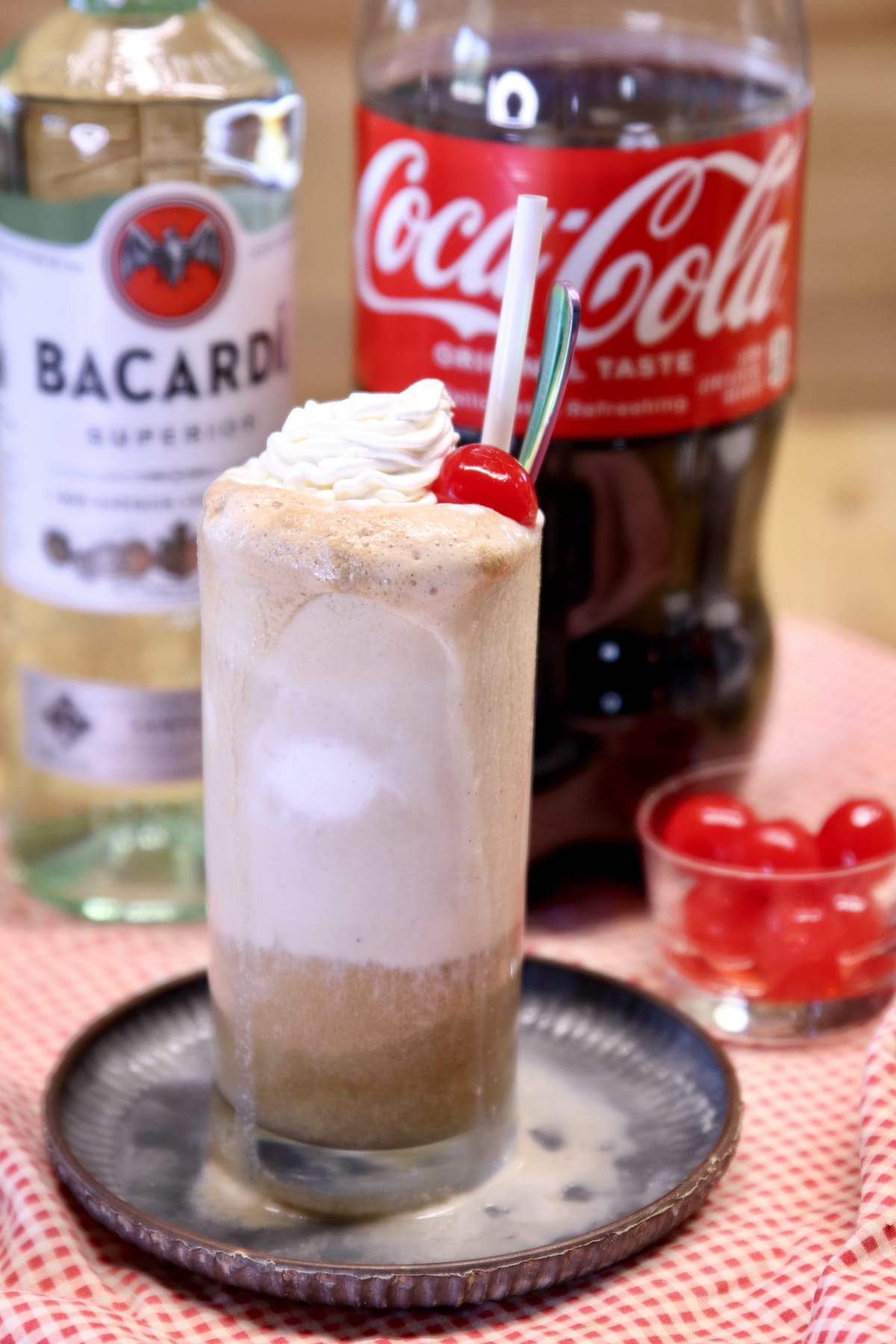 Rum and Coke Float with Bacardi bottle and 2 liter Coke.