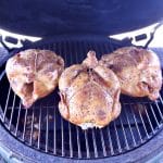 3 whole chickens on a grill.