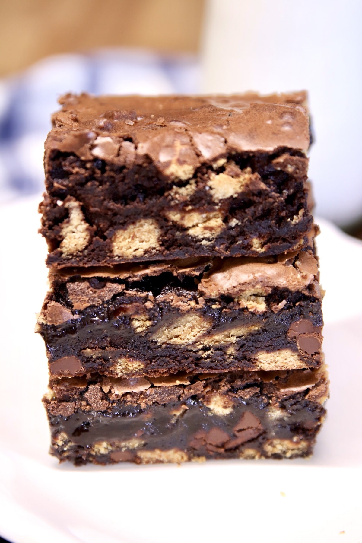 Brownies stacked with peanut butter cookies.