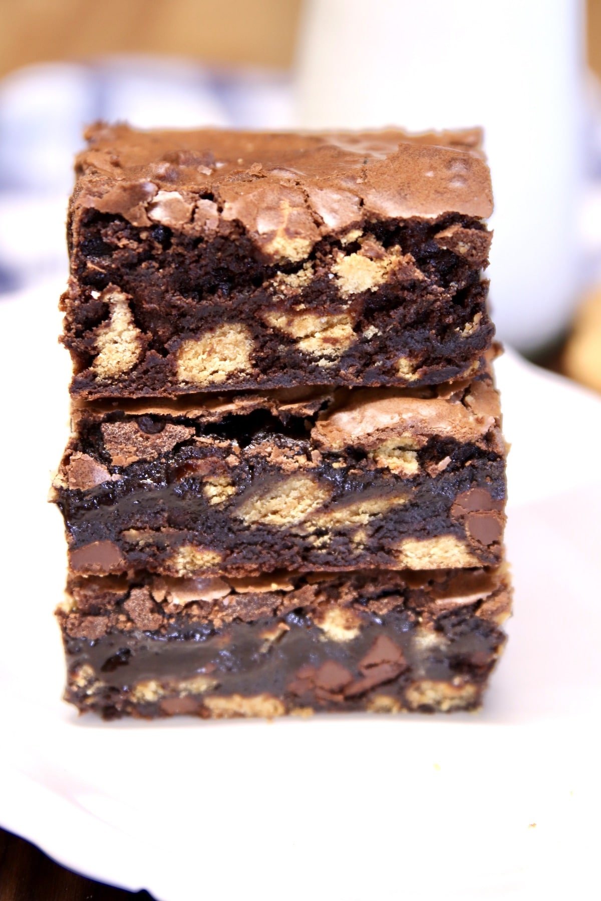 Brownies stacked on a plate.