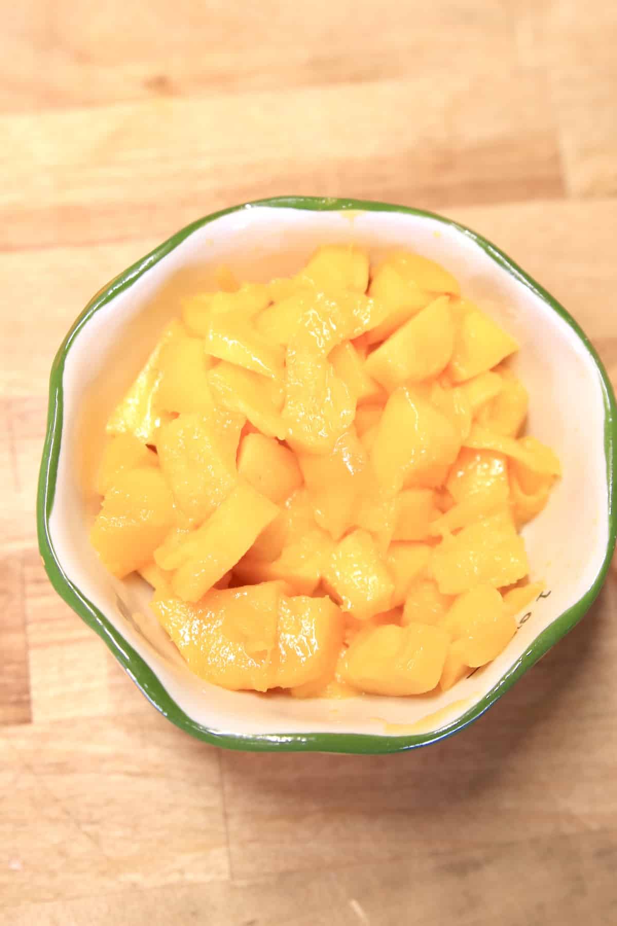 Diced mango in a bowl.