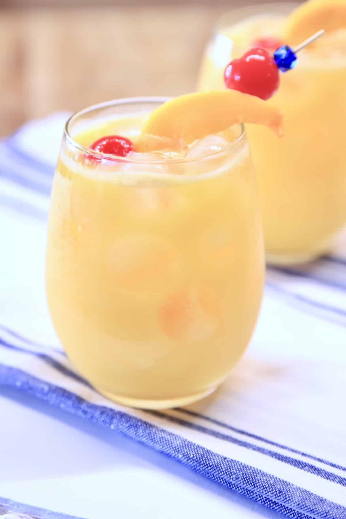 2 glasses with mango cocktails.