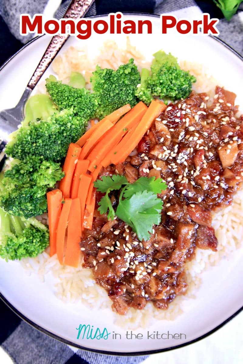 Mongolian Pork on a plate with carrots & broccoli. Text overlay.